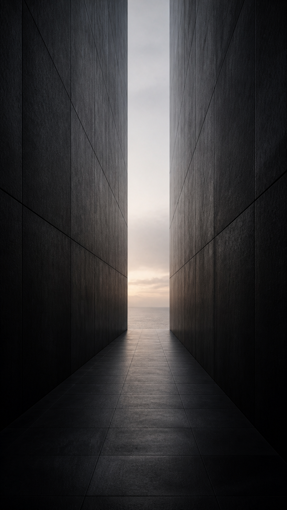A narrow illuminated passage between tall dark walls